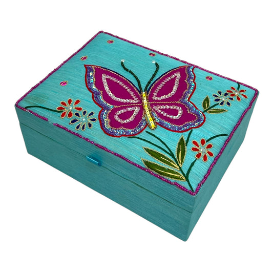 Boîte à bijoux bleue avec papillon